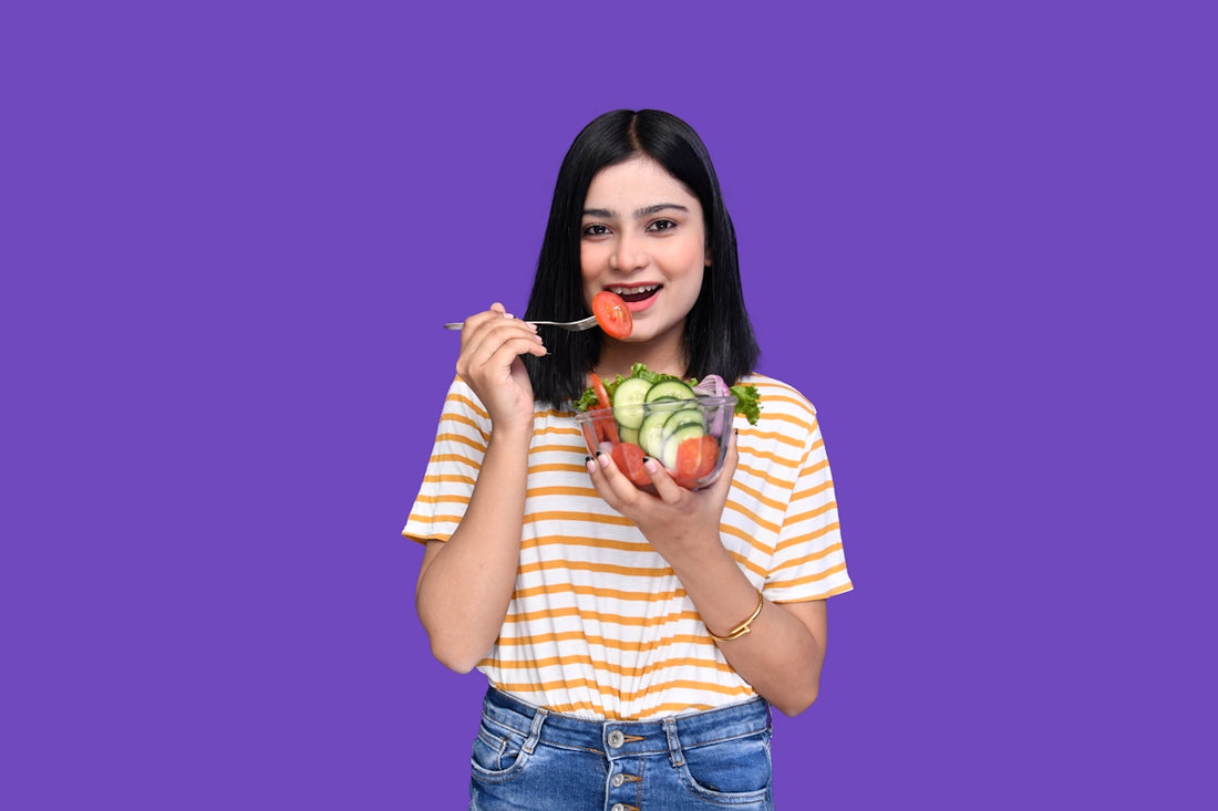 a woman holding a fruit