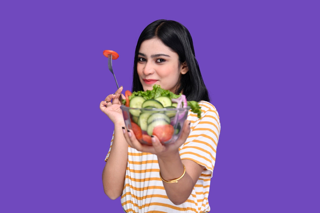 a woman holding a bowl of fruit