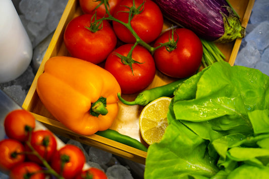 a box filled with lots of different types of vegetables