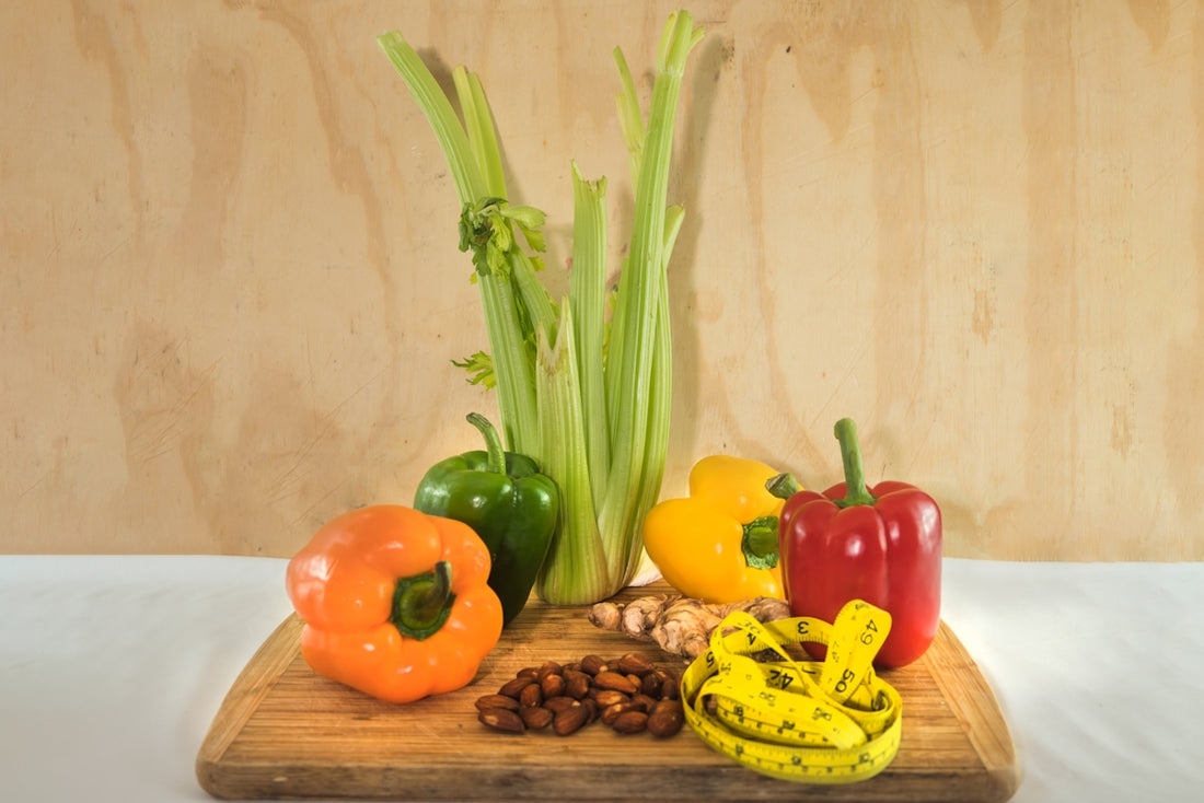 a wooden cutting board topped with assorted vegetables