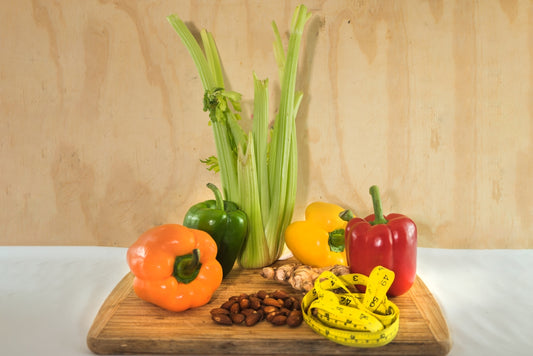 a wooden cutting board topped with assorted vegetables