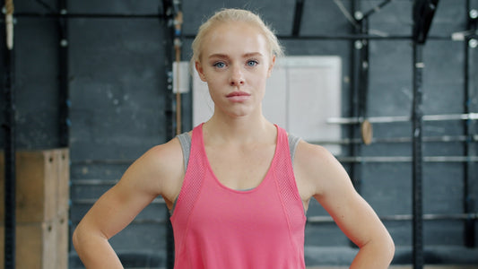 Young woman with blonde hair in gym